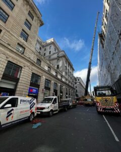 A containerized generator with attenuation and silencer lifted to a London roof